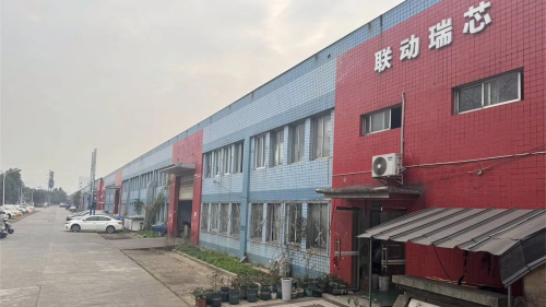 Exterior view of a linear module manufacturer's factory; the company's production base is clean and well-organized, focusing on the research and development and manufacturing of ball screw modules and automated linear transmission systems.