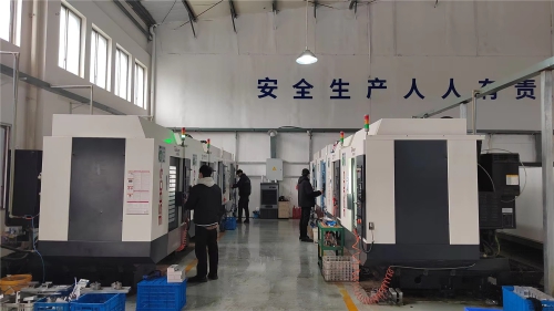 In the CNC machining workshop of a linear module manufacturer, multiple CNC machine tools are machining precision parts for the manufacture of ball screw modules and automated linear drive systems.